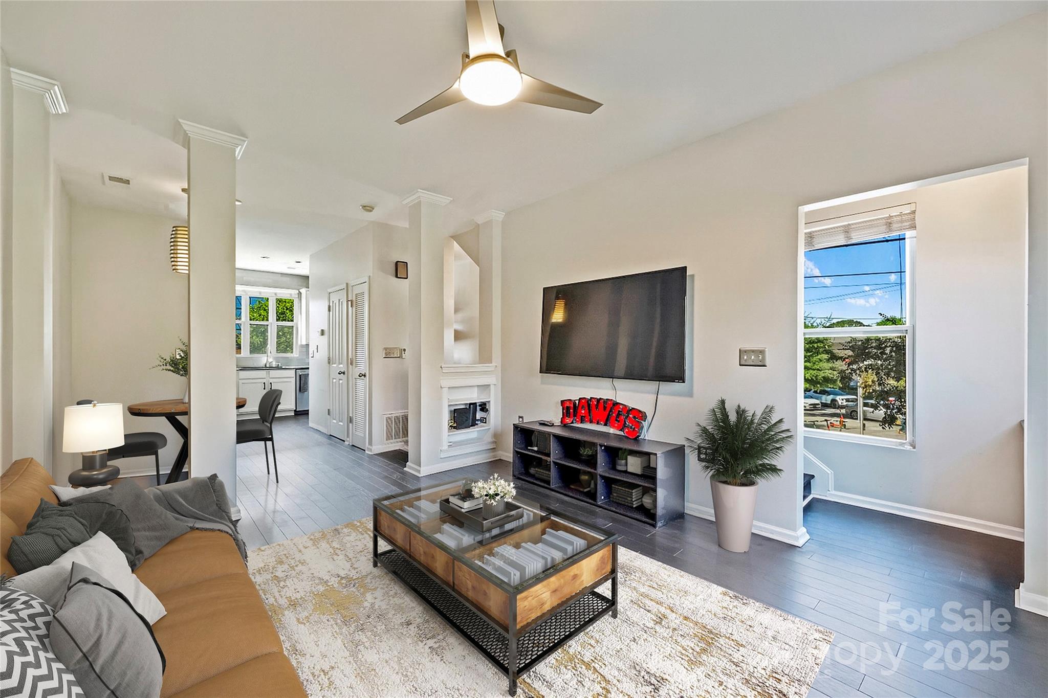 1425 Camden Road Charlotte, NC 28203 - Photo 6 of 37 a living room with furniture a rug and a flat screen tv