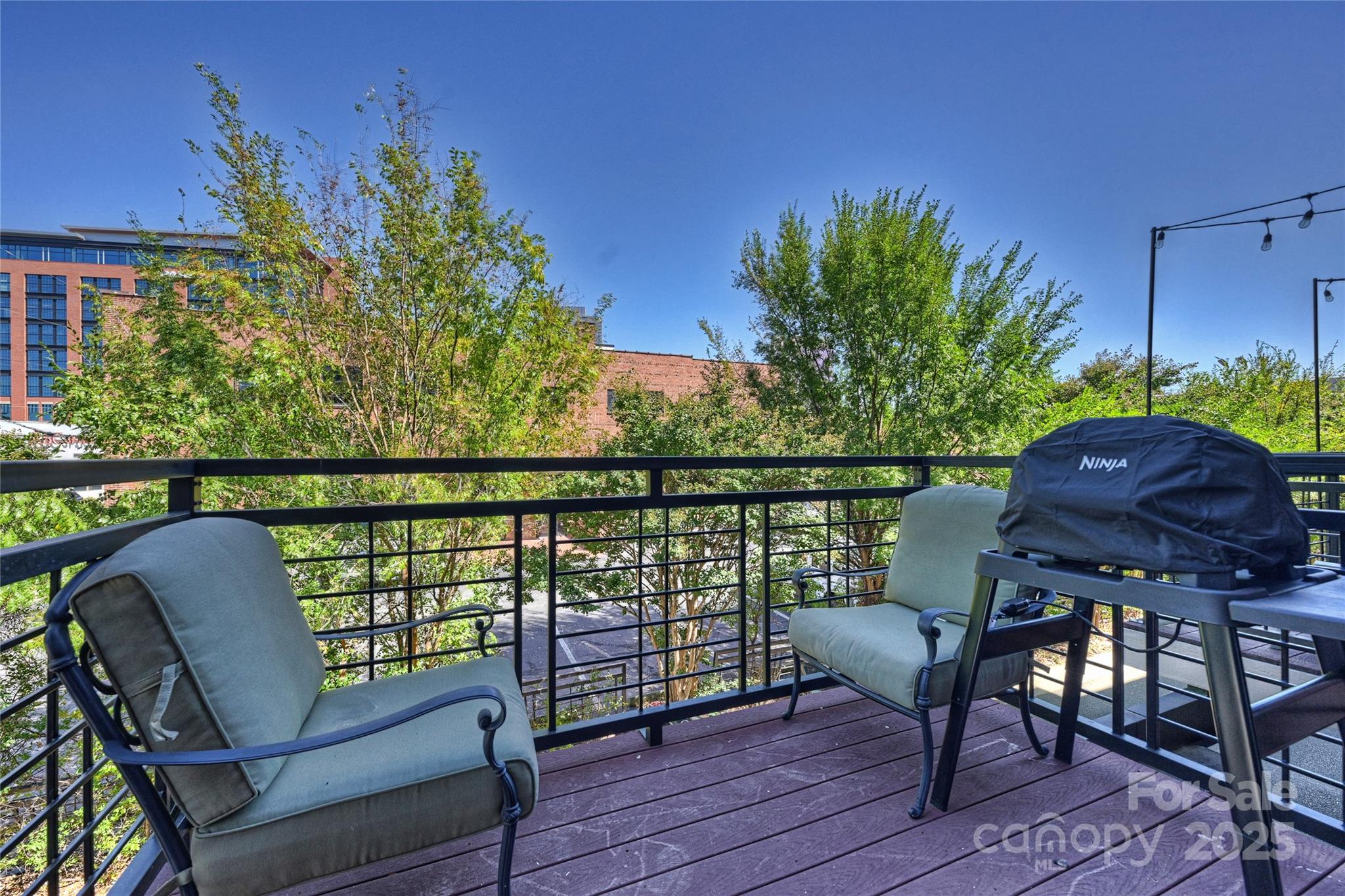 1425 Camden Road Charlotte, NC 28203 - Photo 8 of 37 a balcony with wooden floor table and chairs