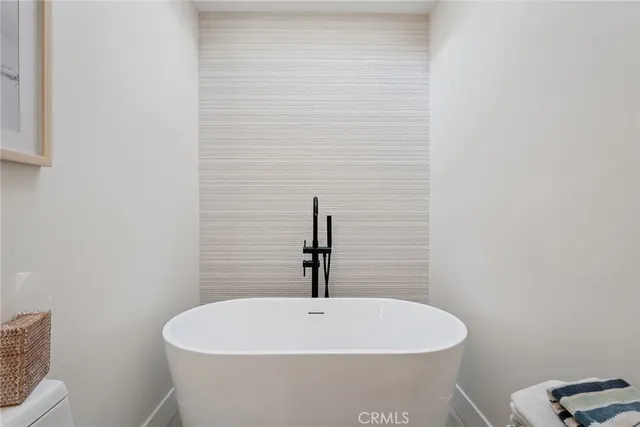 a white bath tub sitting in a bathroom