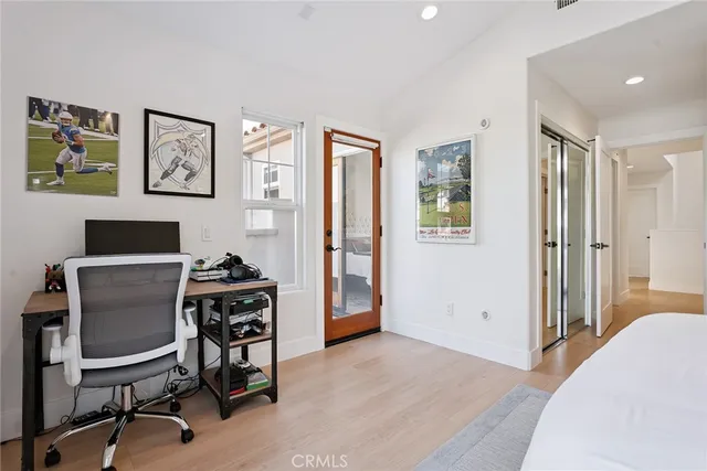 a view of a workspace with furniture and a workspace