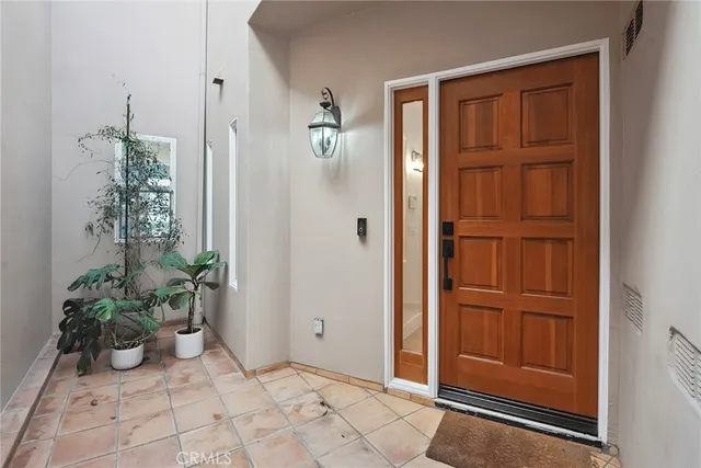 a view of an entryway with a flower pot