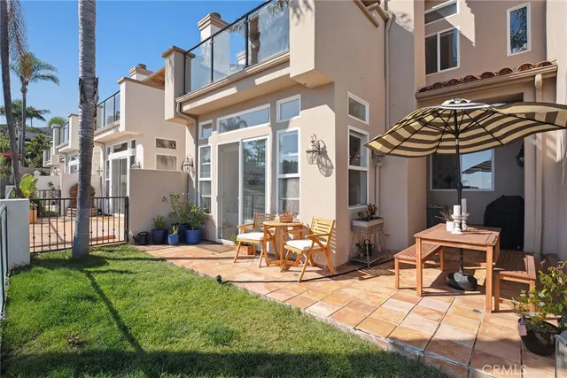 a view of a building with garden and sitting area