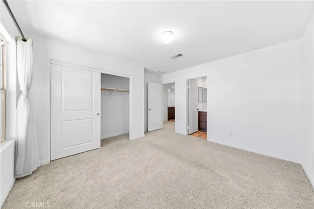 a bathroom with a sink toilet a mirror and shower