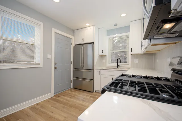 a kitchen with a stove a refrigerator and a stove