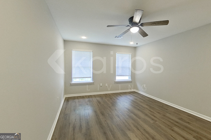 132 Cottage Grove Road Brunswick, GA 31525 - Photo 11 of 17 wooden floor in an empty room with a window
