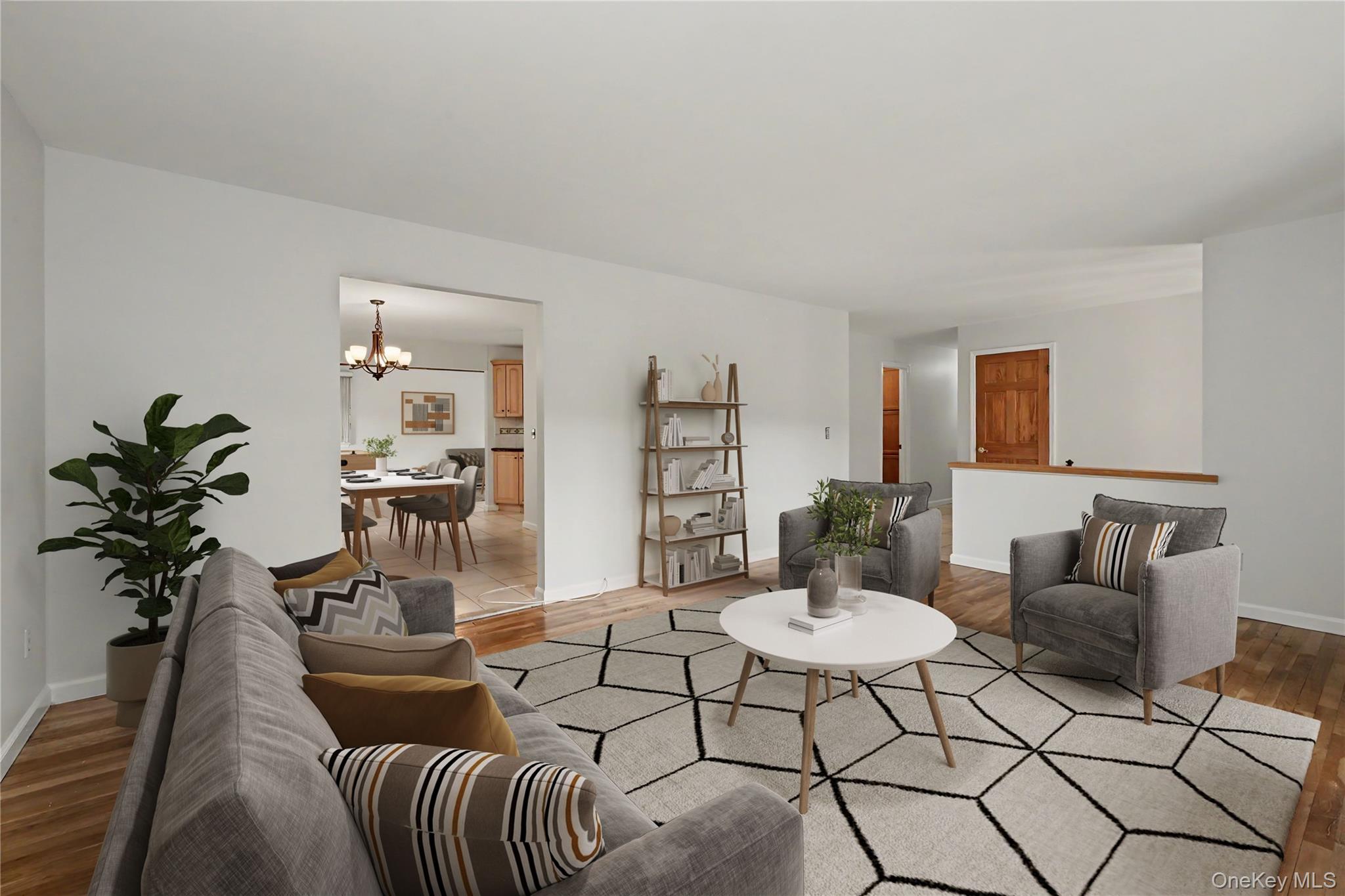 568 Manville Road, Unit UPPER R Pleasantville, NY 10570 - Photo 5 of 32 Virtually staged bright living area featuring wood-finish flooring and white painted walls