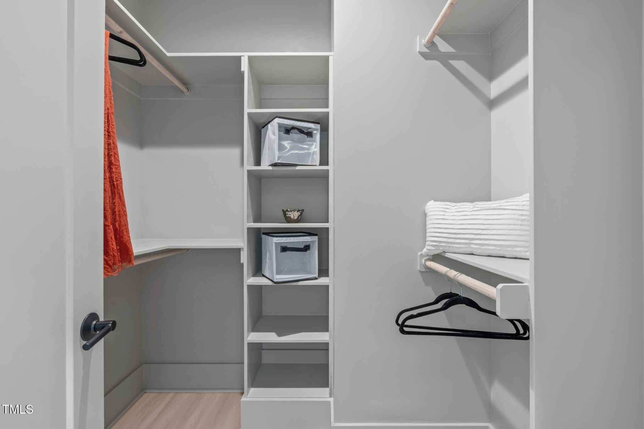 1105 Glascock Street, Unit 101 Raleigh, NC 27610 - Photo 15 of 39 a room with a walk in closet and a mirror