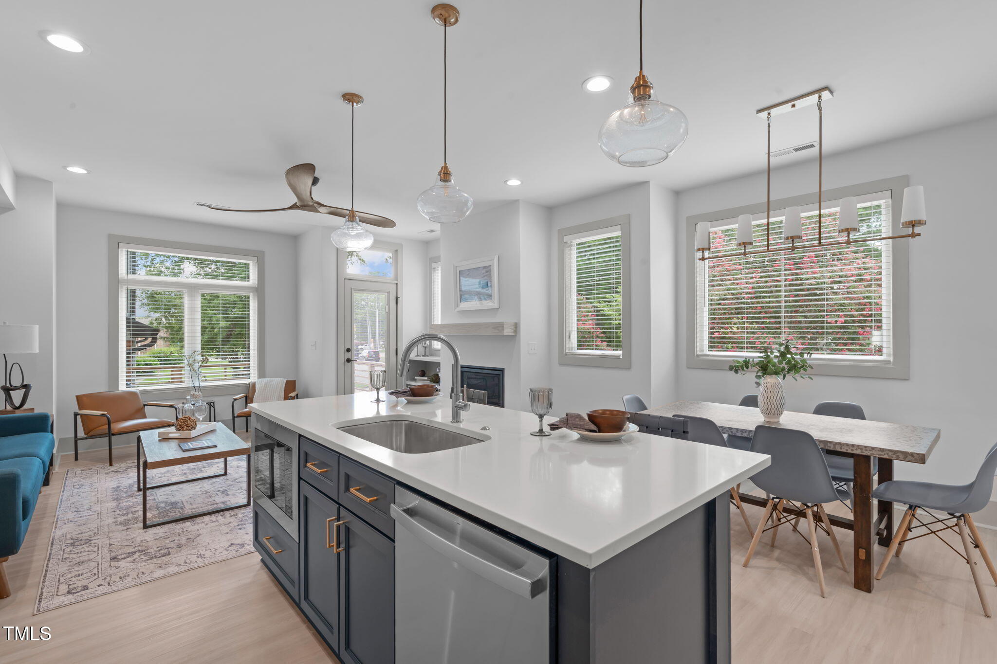 1105 Glascock Street, Unit 101 Raleigh, NC 27610 - Photo 4 of 39 a kitchen with center island table and chairs
