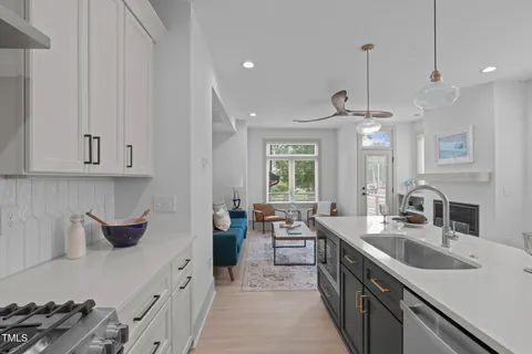 a kitchen with lots of counter space and windows
