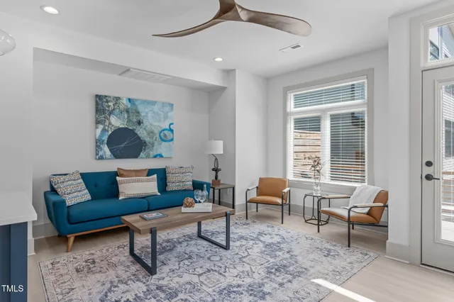 a living room with furniture and a window