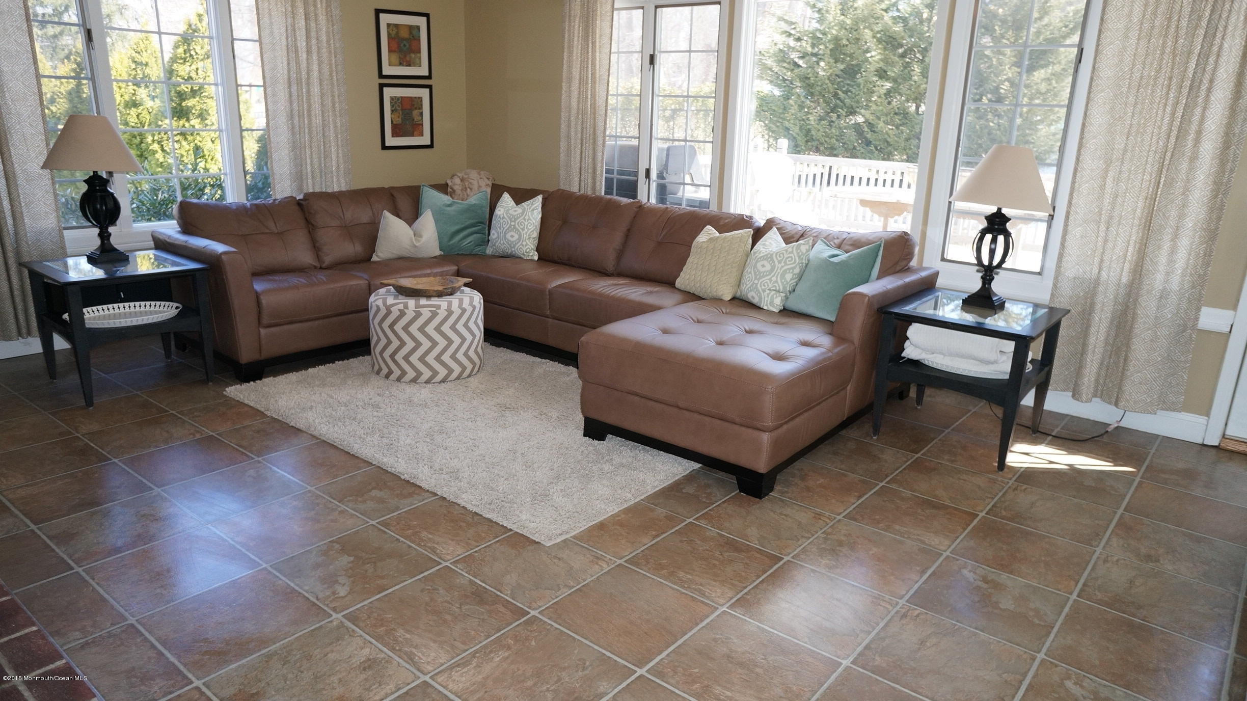 69 Half Mile Road Middletown, NJ 07701 - Photo 11 of 40 a living room with furniture and a large window
