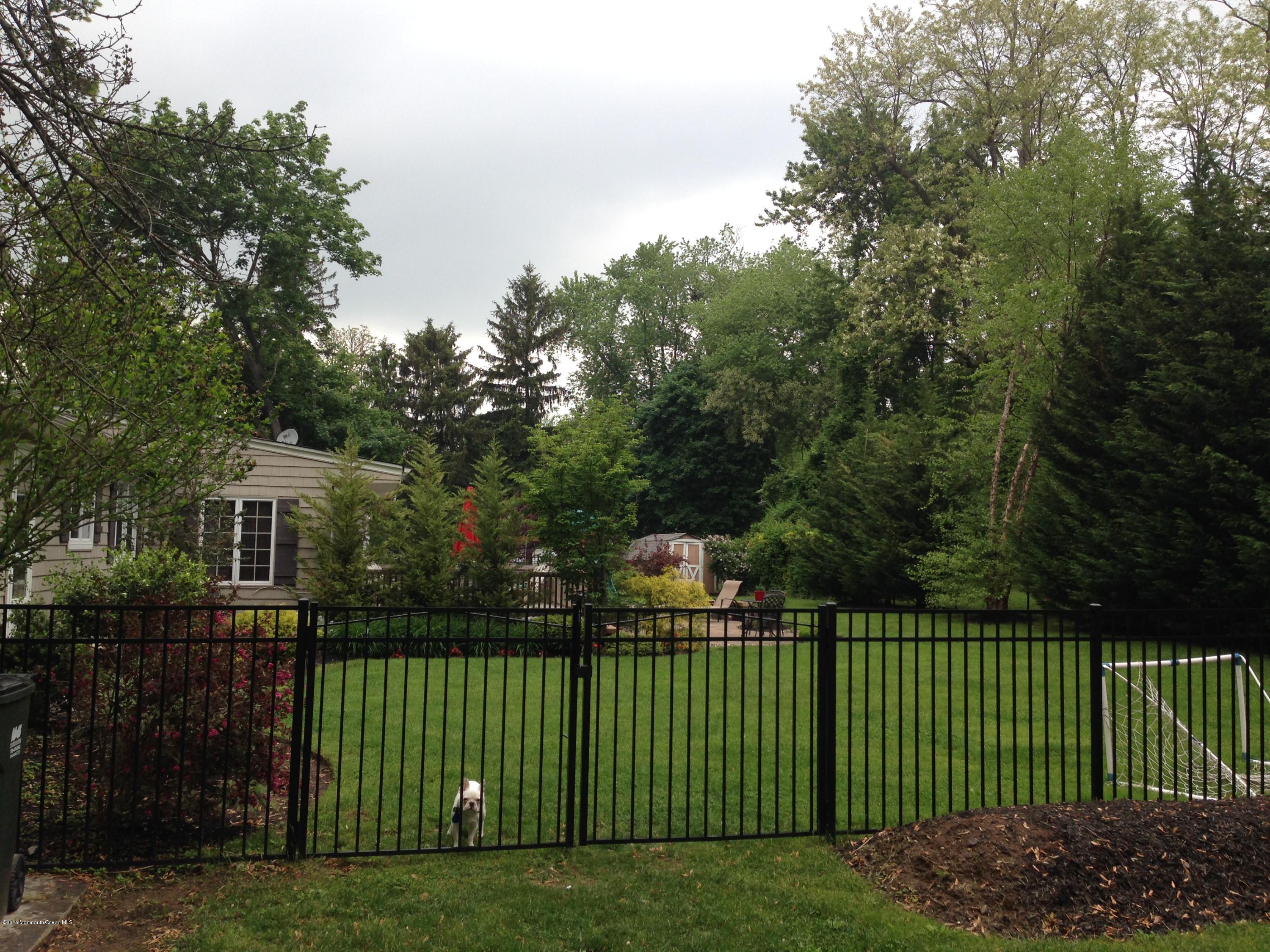 69 Half Mile Road Middletown, NJ 07701 - Photo 33 of 40 a view of a wrought iron fences in front of house