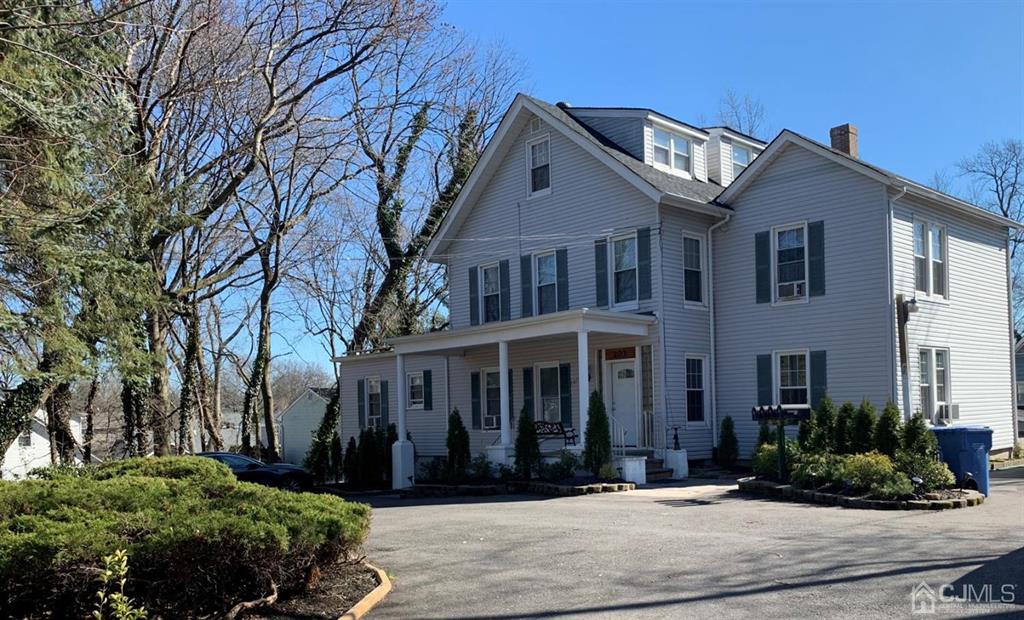 203 Woodbridge Avenue, Unit 2 Metuchen, NJ 08840 - Photo 1 of 13 a front view of a house with a yard