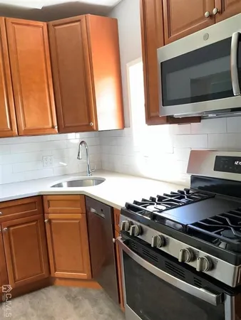 a kitchen with a stove and a microwave