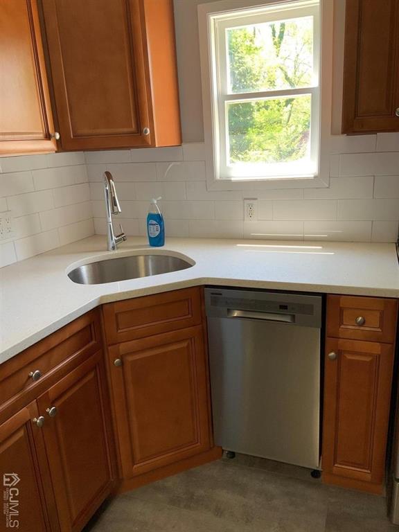 203 Woodbridge Avenue, Unit 2 Metuchen, NJ 08840 - Photo 10 of 13 a kitchen with a sink cabinets and a window
