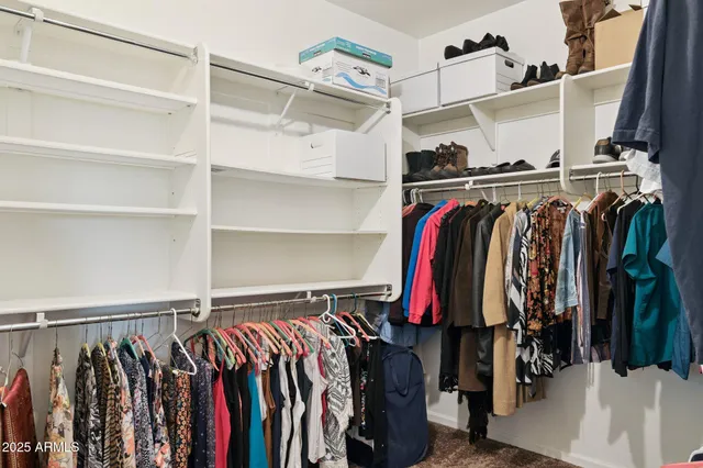 a spacious bathroom with a tub sink and mirror