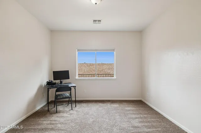 a white bath tub sitting next to a shower