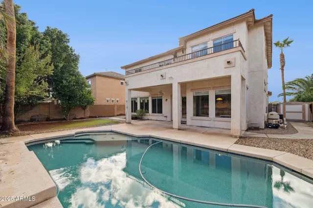 a bed room with a bed and a chair