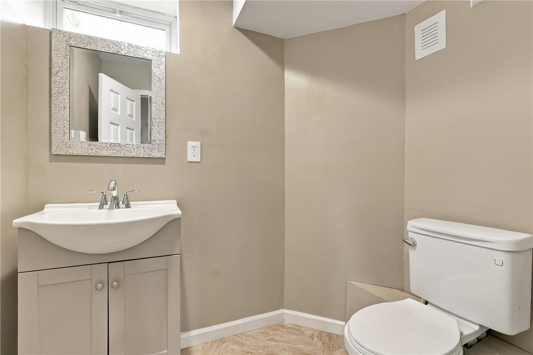 1657 Rachel Road Stroudsburg, PA 18360 - Photo 36 of 46 Clean lines and a neutral palette define this compact powder room featuring a modern vanity.