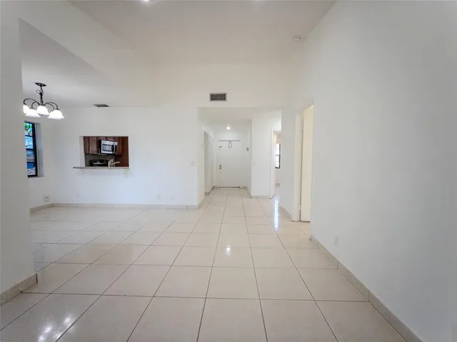 a view of a hallway with a bathroom