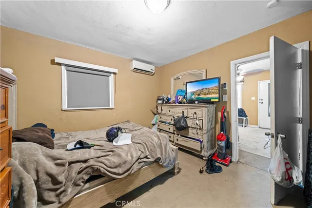 a kitchen with granite countertop a sink appliances cabinets and furniture