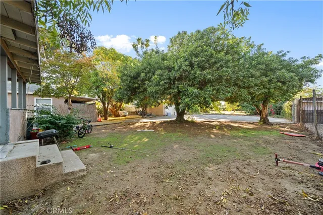 a view of a street with a building in the background