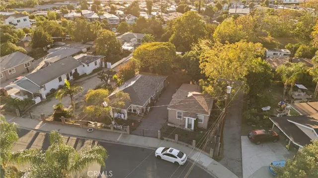 an aerial view of residential houses with outdoor space