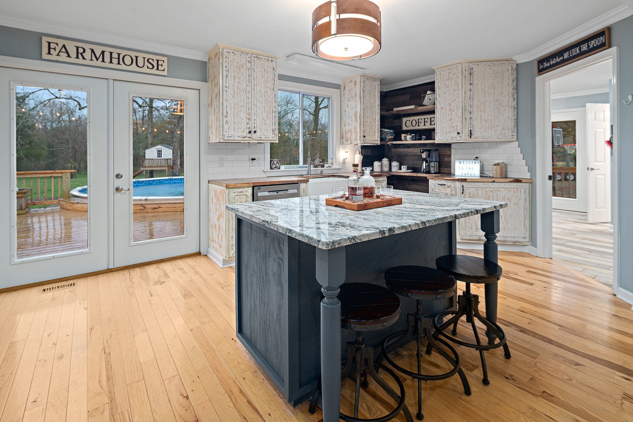 13577 Versailles Road Rockvale, TN 37153 - Photo 14 of 50 a kitchen with a table chairs sink and cabinets
