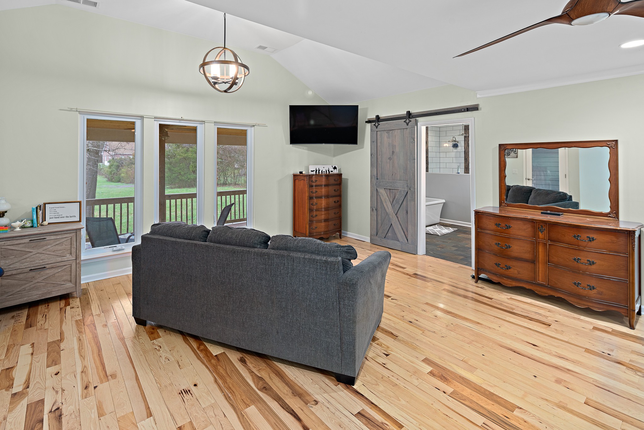 13577 Versailles Road Rockvale, TN 37153 - Photo 18 of 50 a living room with furniture and a flat screen tv