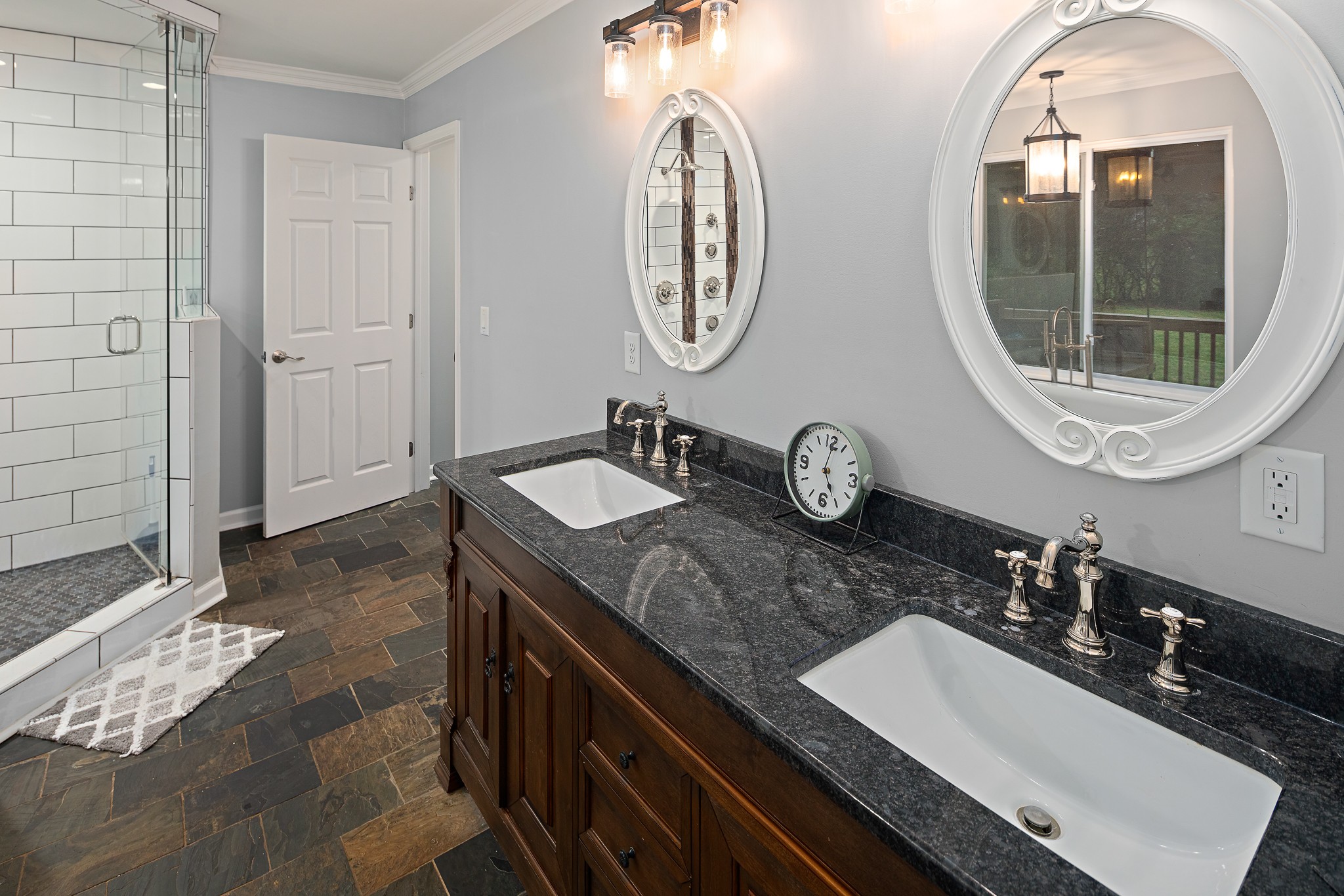 13577 Versailles Road Rockvale, TN 37153 - Photo 19 of 50 a bathroom with a double vanity sink and a mirror