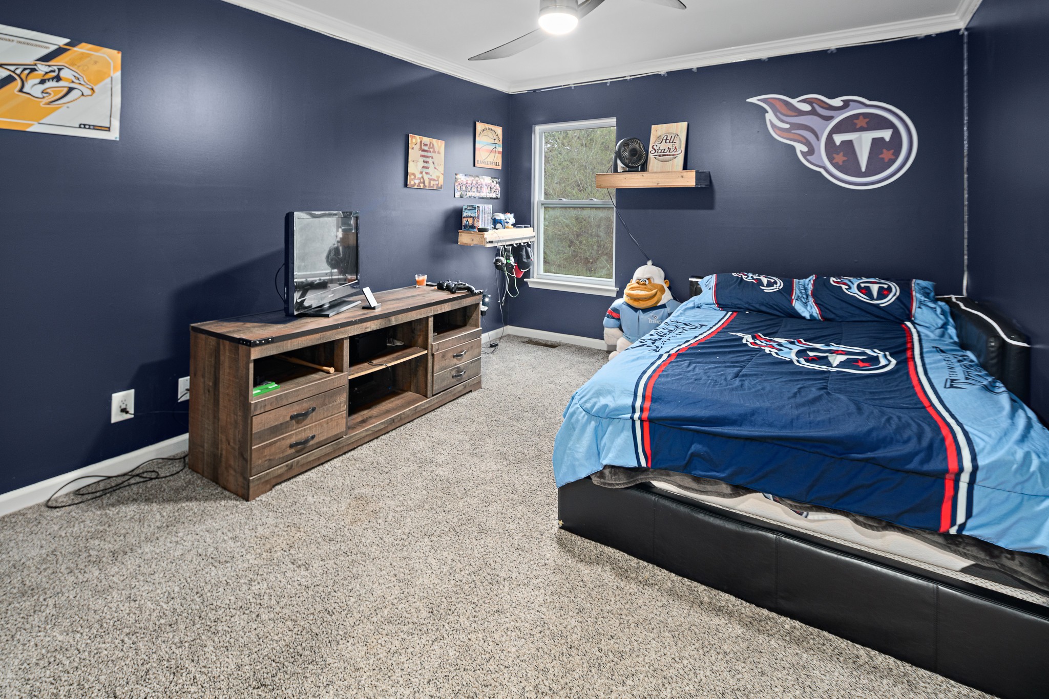 13577 Versailles Road Rockvale, TN 37153 - Photo 26 of 50 a bed room with a bed and a television