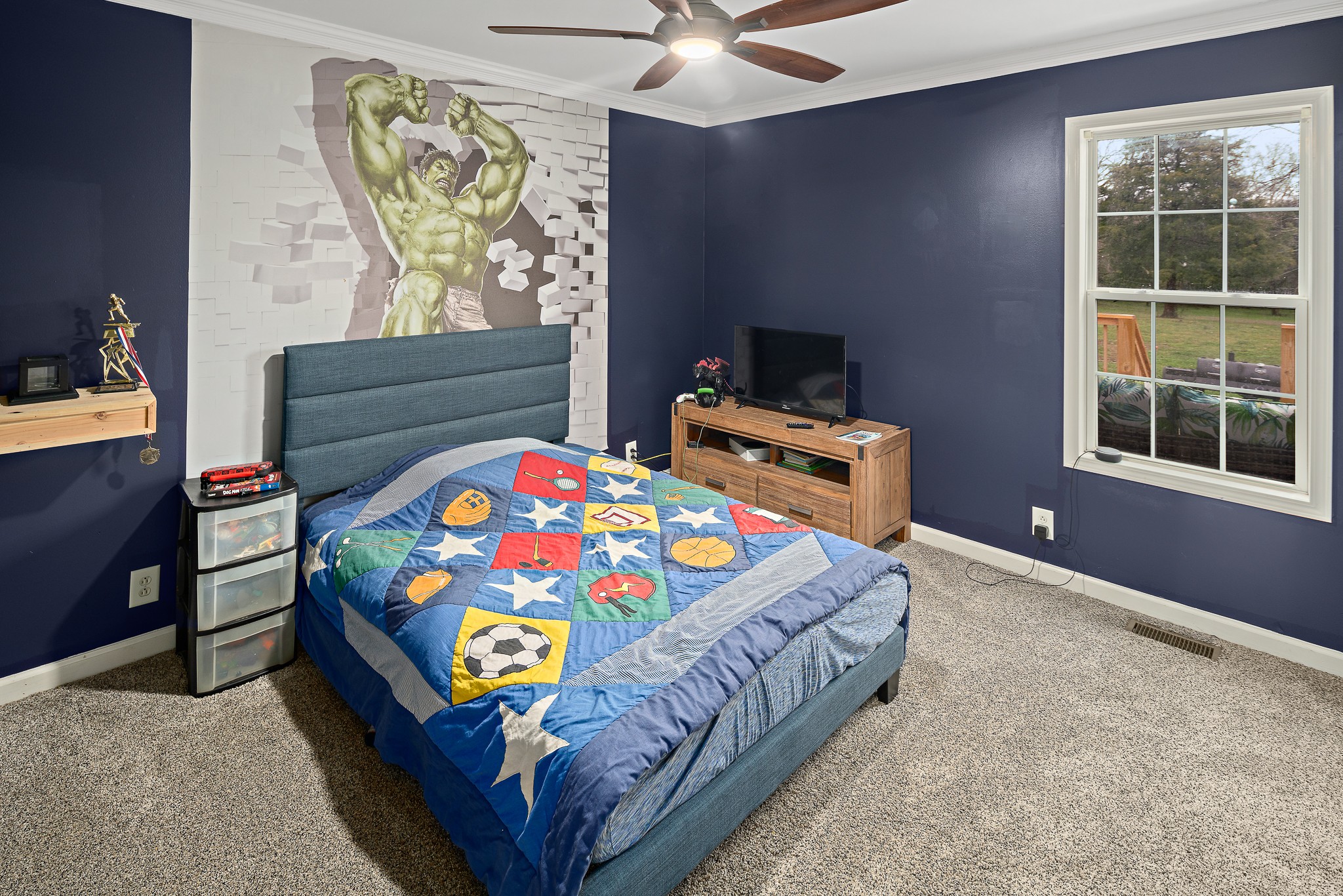 13577 Versailles Road Rockvale, TN 37153 - Photo 29 of 50 a bedroom with a bed that has a blanket and a chair