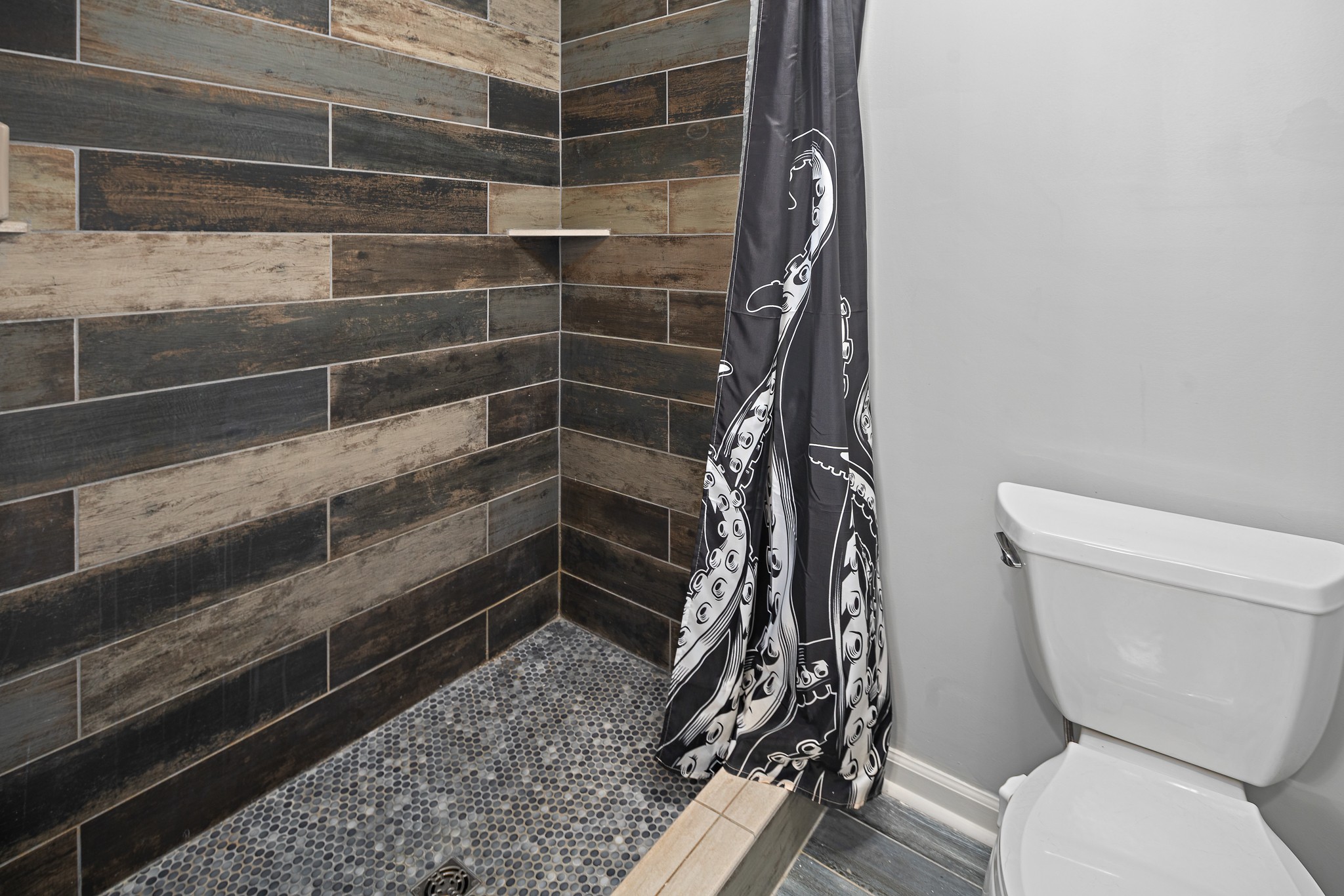 13577 Versailles Road Rockvale, TN 37153 - Photo 31 of 50 a bathroom with a toilet and a shower