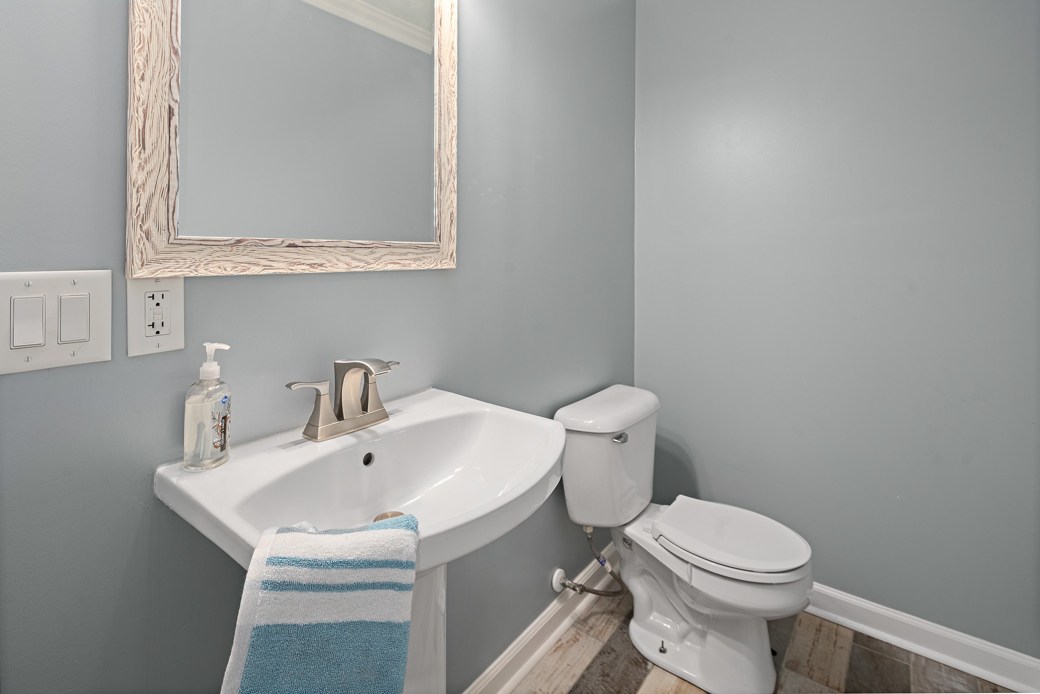 13577 Versailles Road Rockvale, TN 37153 - Photo 33 of 50 a white toilet sitting next to a bathroom sink