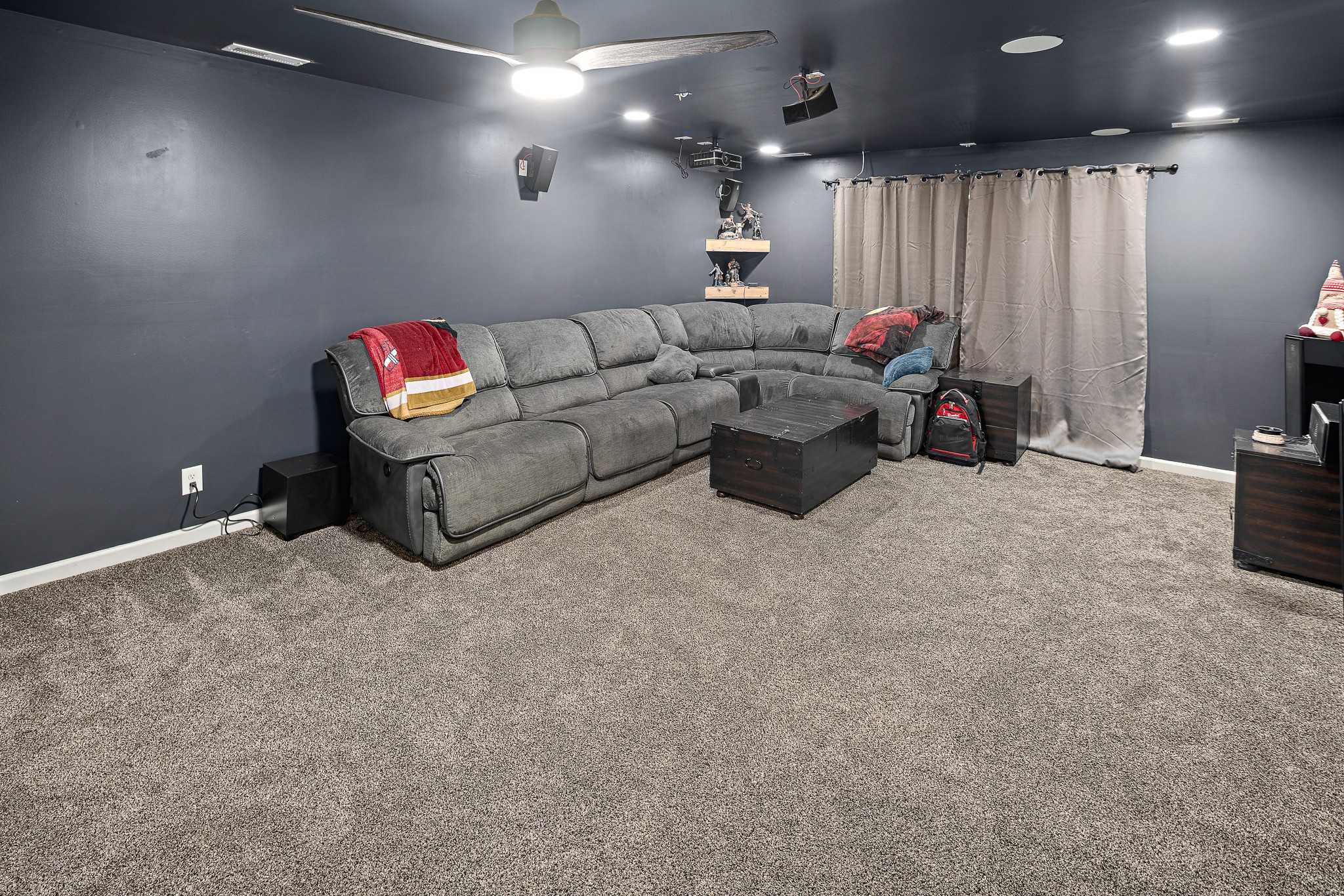 13577 Versailles Road Rockvale, TN 37153 - Photo 35 of 50 a living room with furniture a flat screen tv and a chandelier