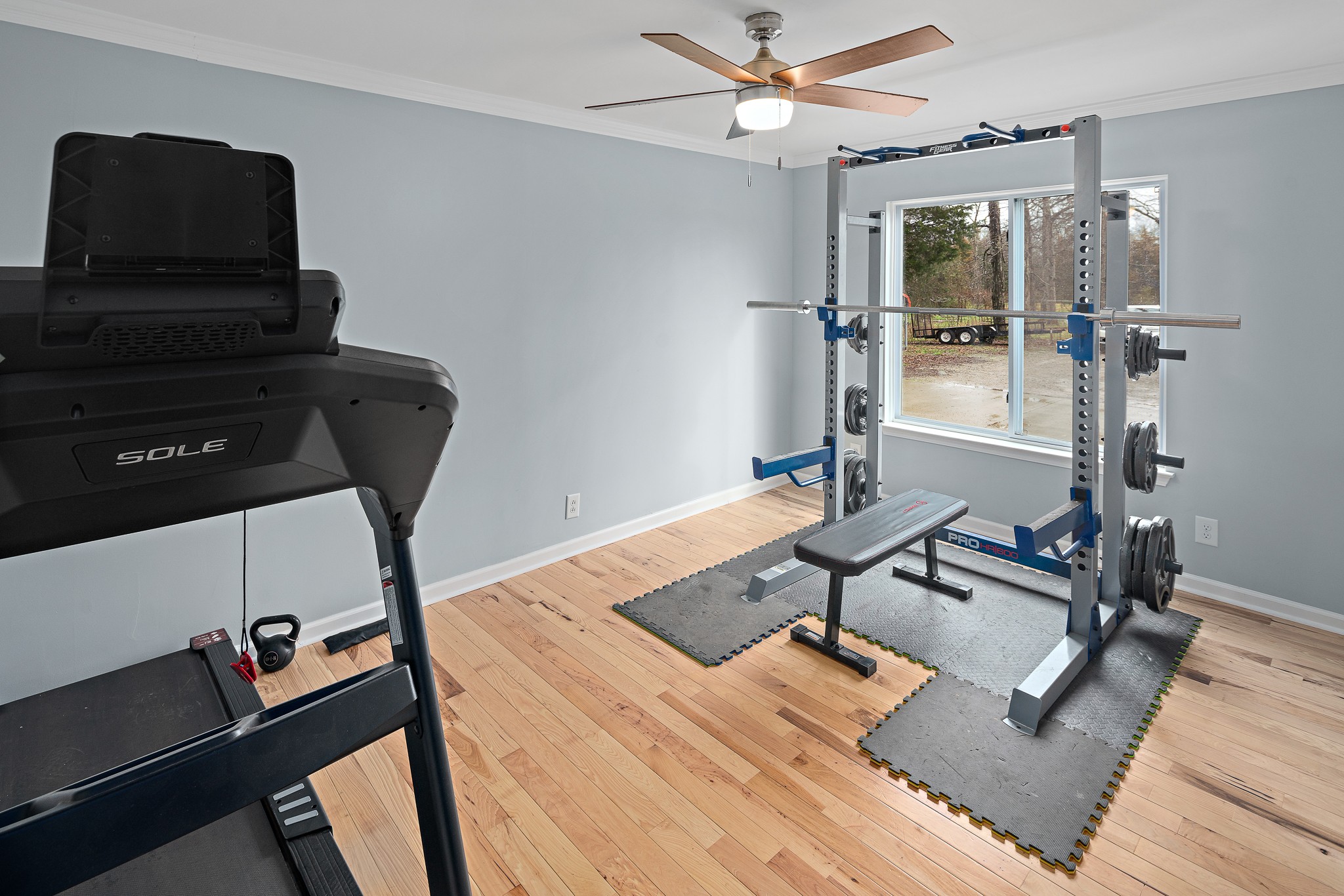 13577 Versailles Road Rockvale, TN 37153 - Photo 36 of 50 a view of a workspace with furniture and gym equipment