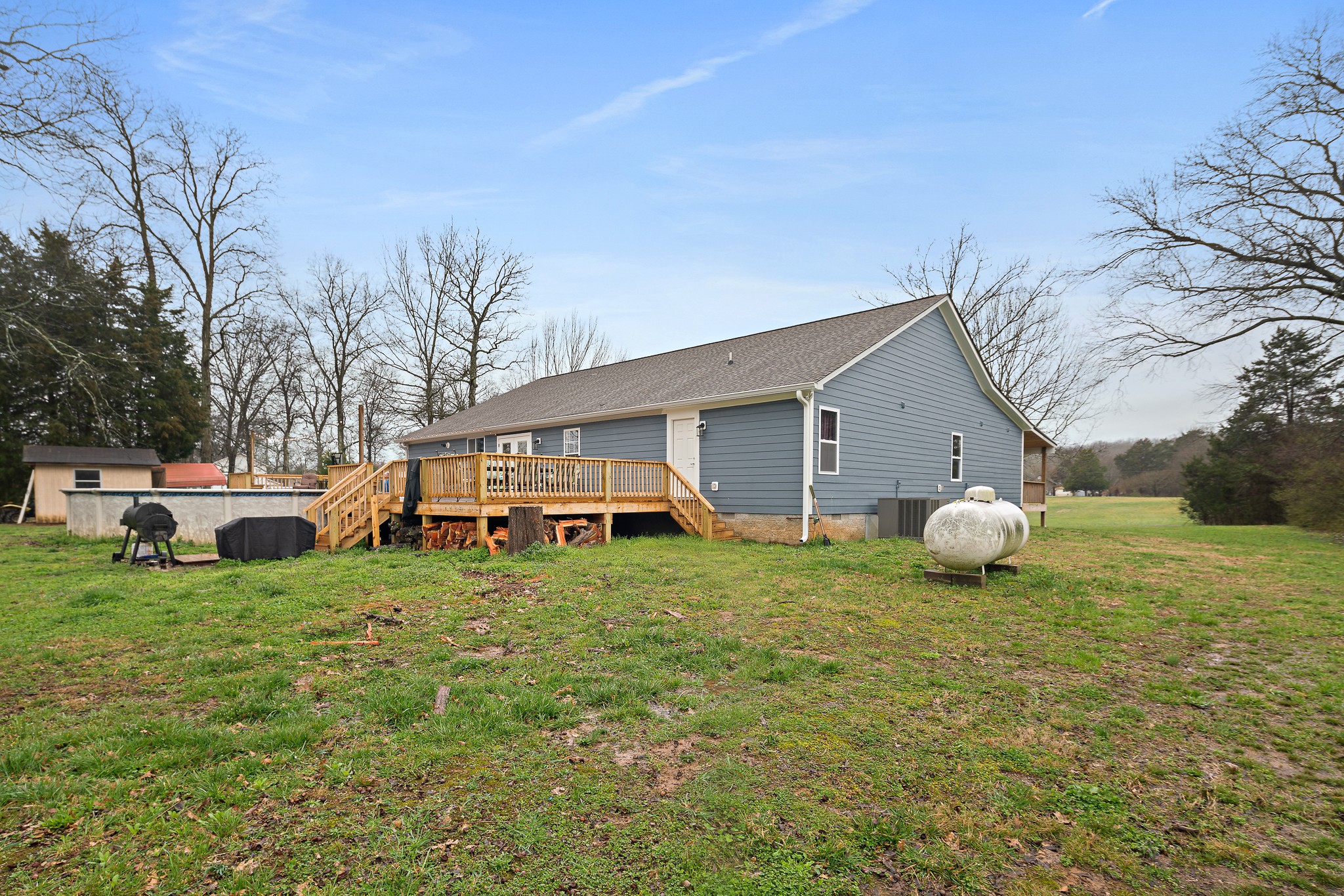 13577 Versailles Road Rockvale, TN 37153 - Photo 46 of 50 a view of a house with a yard and sitting area