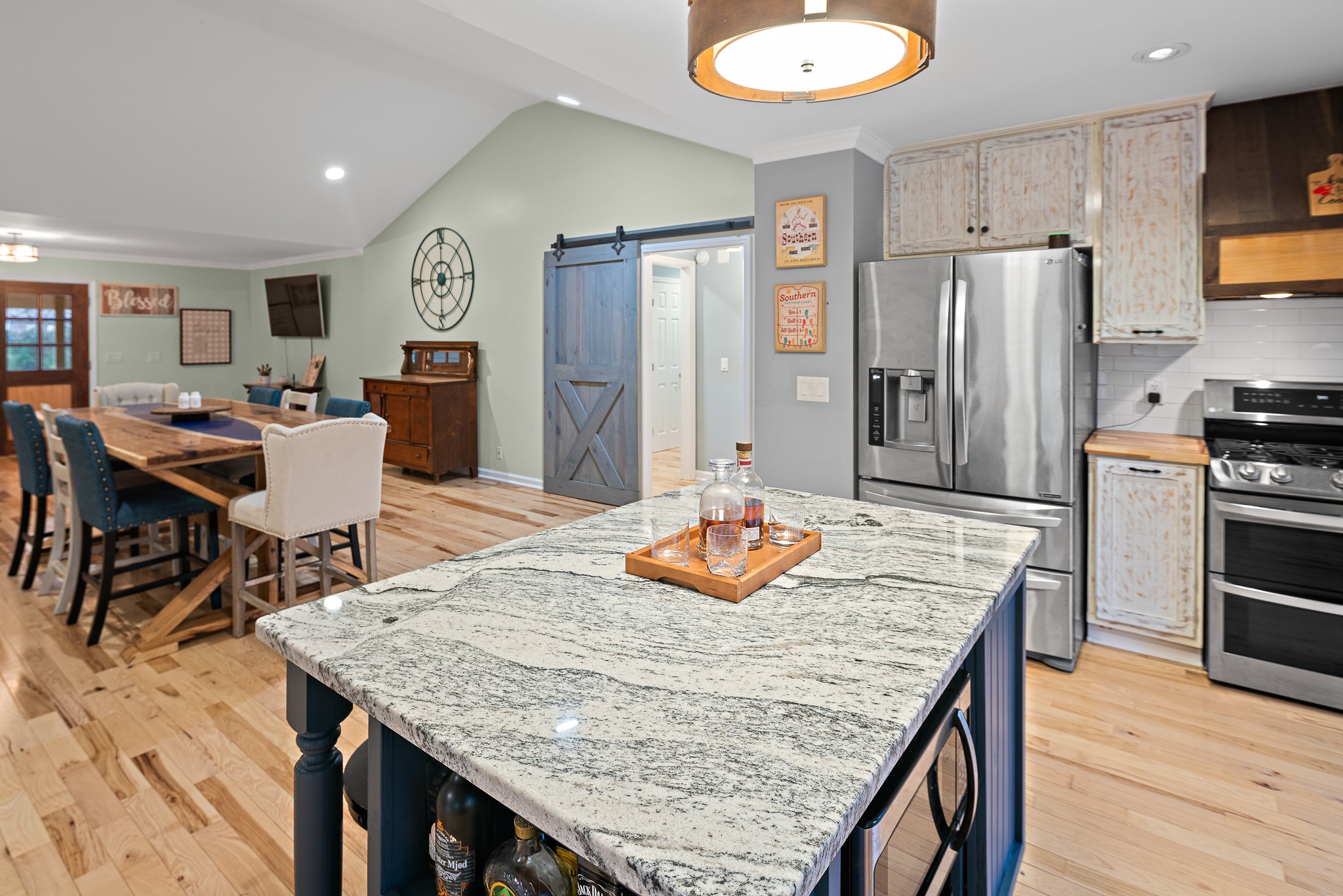 13577 Versailles Road Rockvale, TN 37153 - Photo 10 of 50 a kitchen with granite countertop kitchen island stainless steel appliances and wooden cabinets