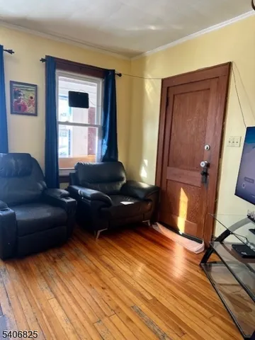 a view of a living room with entryway