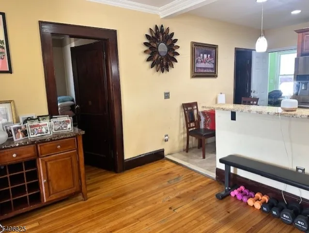 a kitchen with stainless steel appliances granite countertop a stove top oven a sink dishwasher and a microwave