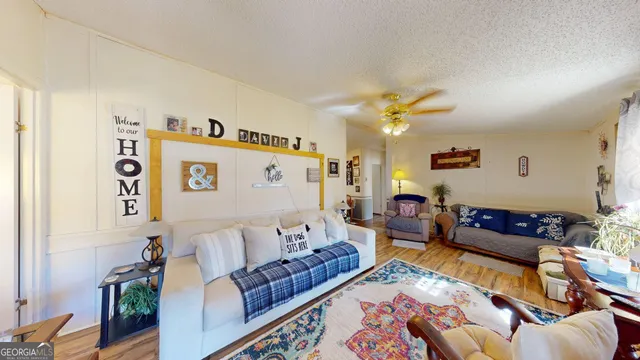 a living room with furniture rug and window