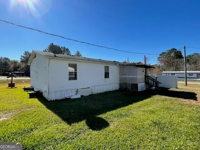 a view of a backyard with plants