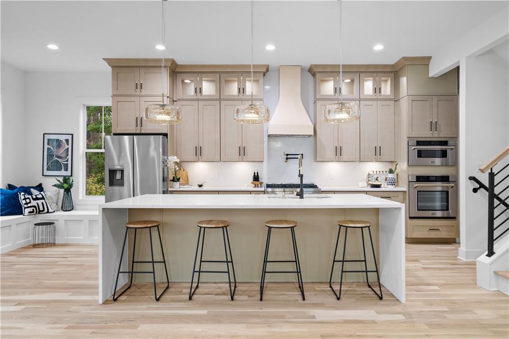 515 Chevelle Lane Decatur, GA 30030 - Photo 14 of 39 a kitchen with stainless steel appliances granite countertop a dining table chairs stove refrigerator and cabinets