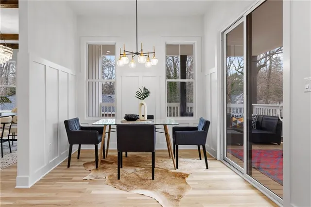 a view of a dining room with furniture window and wooden floor
