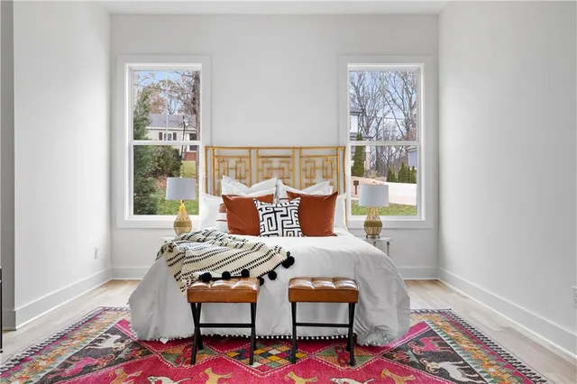 a bedroom with furniture and a window