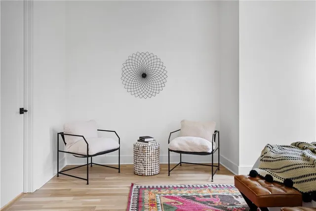 a living room with furniture and a chair