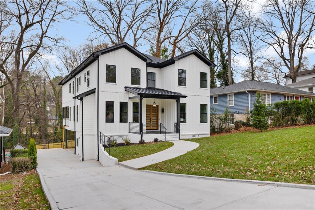 515 Chevelle Lane Decatur, GA 30030 - Photo 2 of 39 a front view of a house with a yard table and chairs