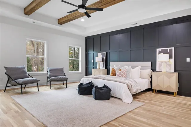 a bedroom with furniture and a window