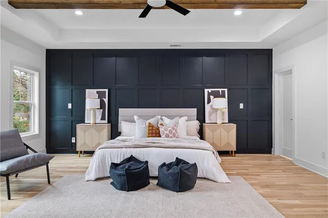 a bedroom with a bed and a chair