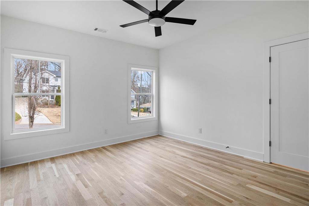 515 Chevelle Lane Decatur, GA 30030 - Photo 33 of 39 a view of an empty room with a window and wooden floor